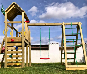 Wooden climbing frame with swing, climbing net, ladder, and slide in a backyard